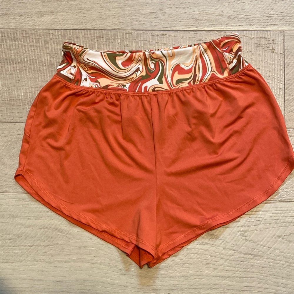 Vibrant Orange Athletic Shorts with Curved Hem